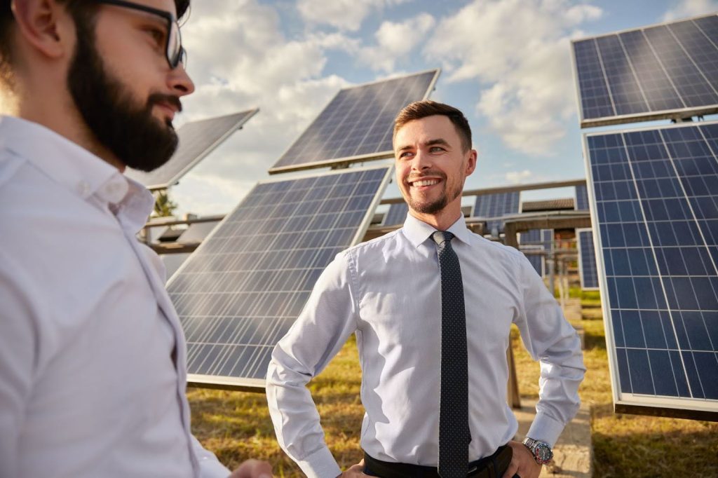 Two men discussing solar panel installation